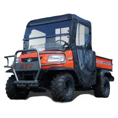 Orange utility vehicle with black canopy, brush guard, and rugged tires.