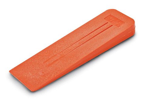 Orange plastic felling wedge with three vertical grooves and a logo, angled on a white surface.