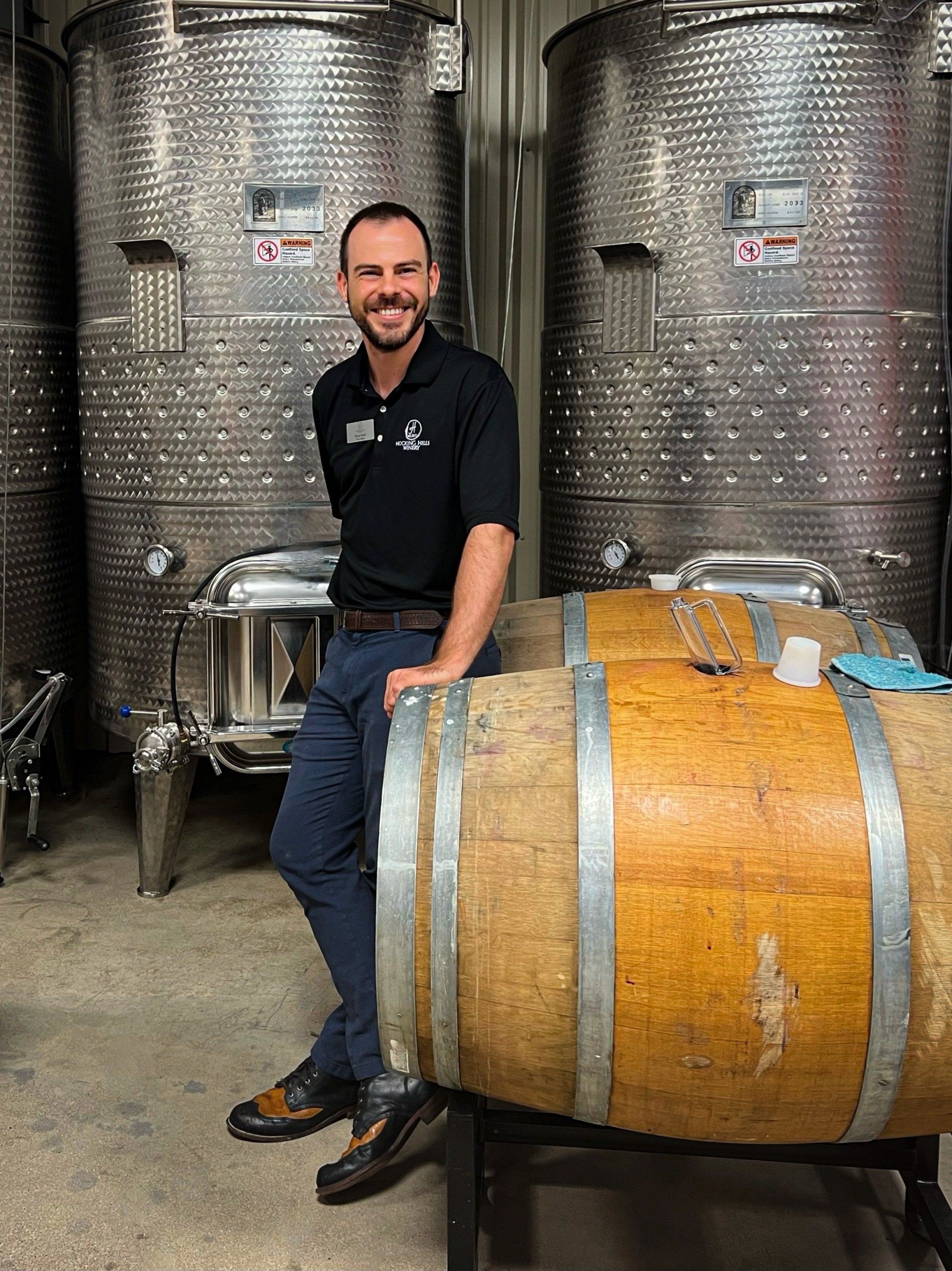 Hocking Hills Winery Winemaker with wine barrels