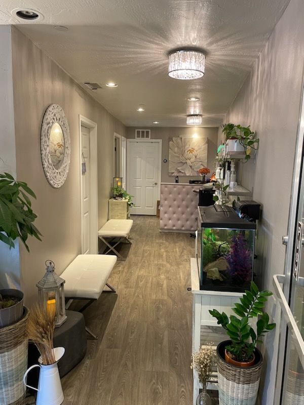 A long hallway with a fish tank in the middle of it.