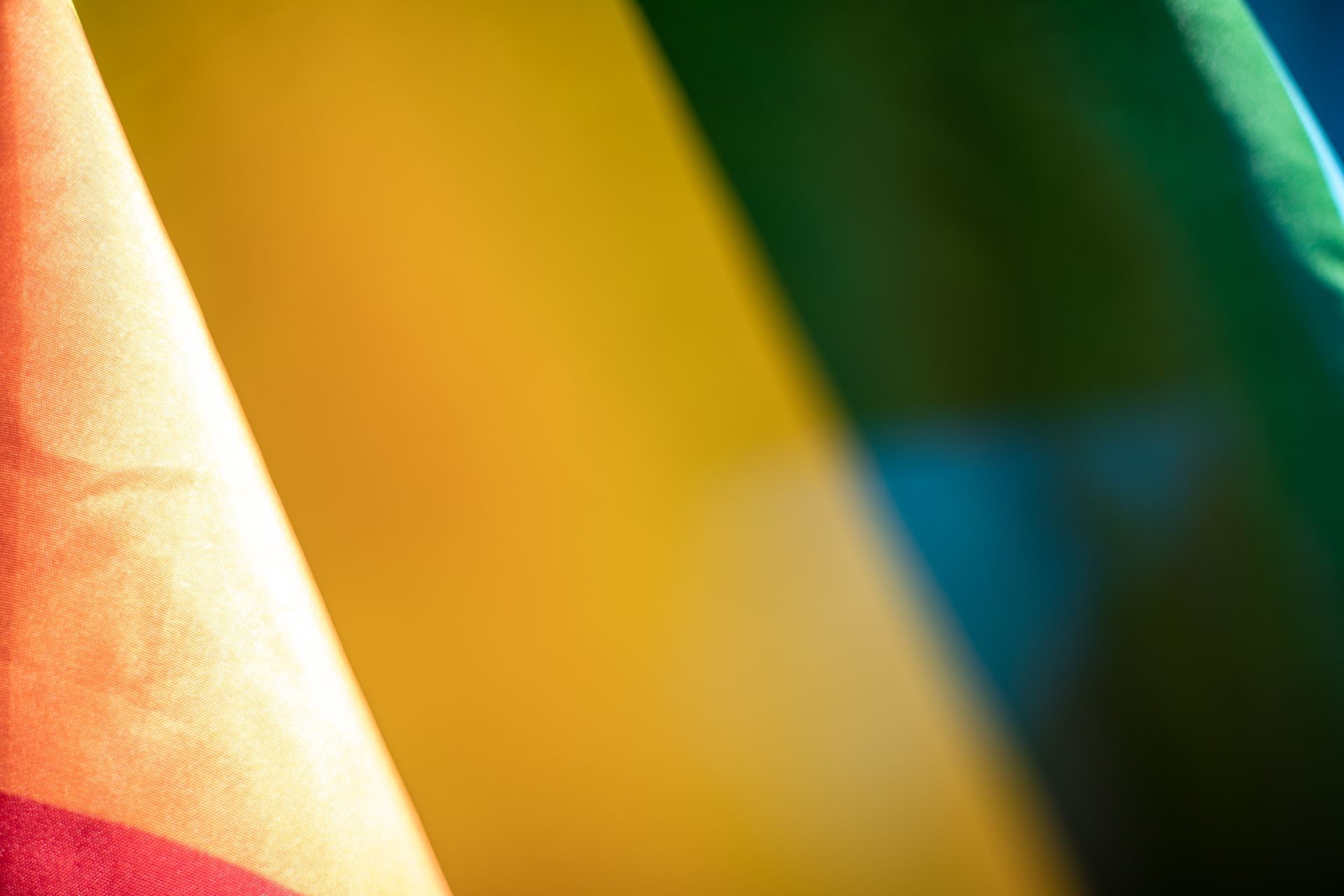 Pride flag, close-up. Red, orange, yellow, green, blue, and purple colors.