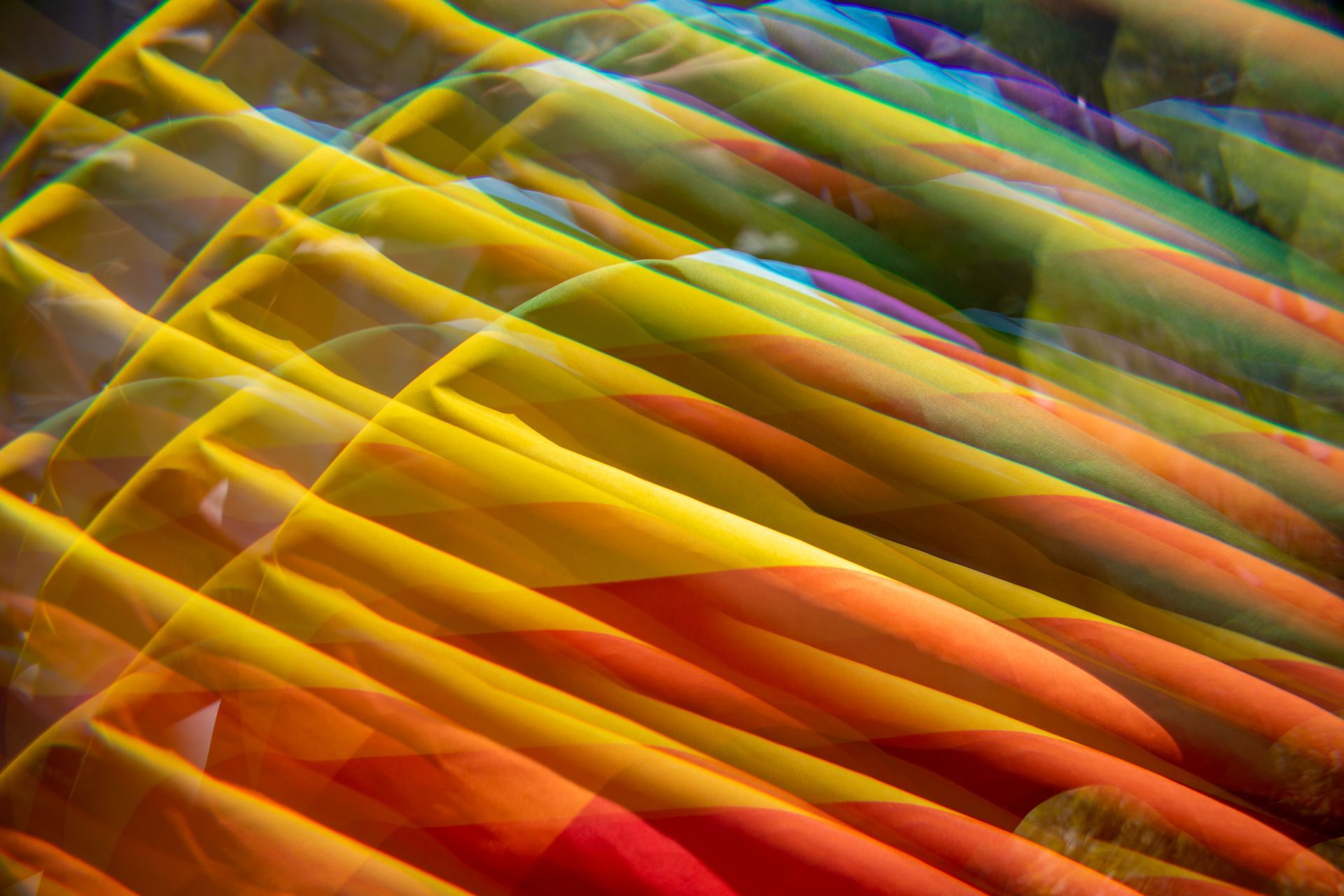 A close up of a colorful fabric with a rainbow of colors.