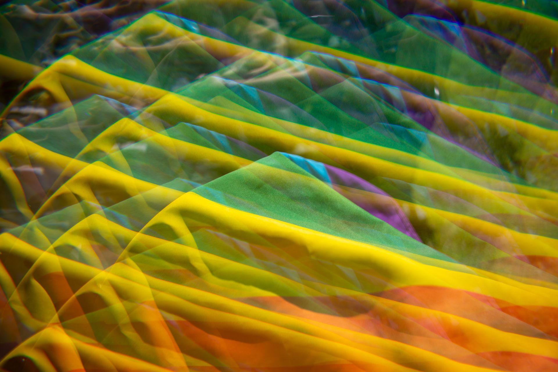 A close up of a colorful fabric with a rainbow of colors.