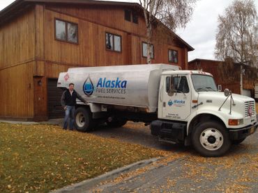 An Alaska Fuel Services' truck in front of a clients house