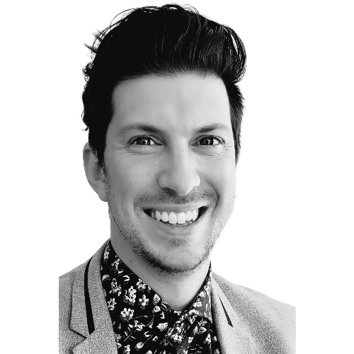 A portrait of a person with dark hair, wearing a dark turtleneck and a textured jacket, against a white background.