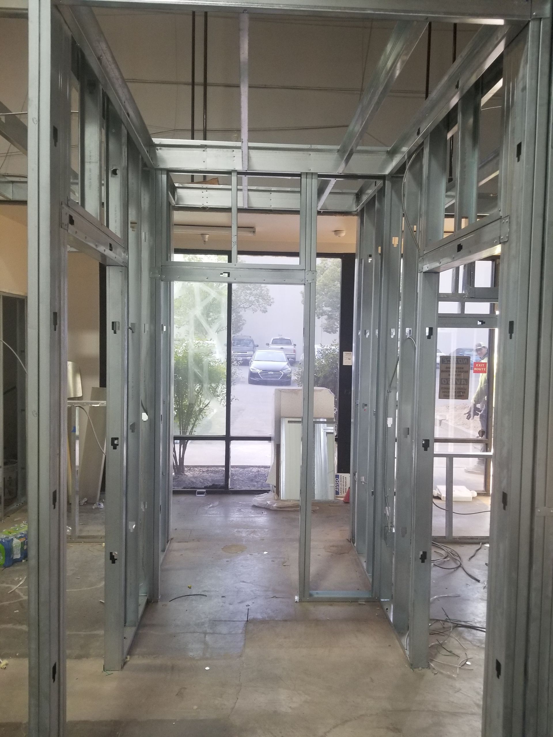 A hallway with a lot of windows and metal walls