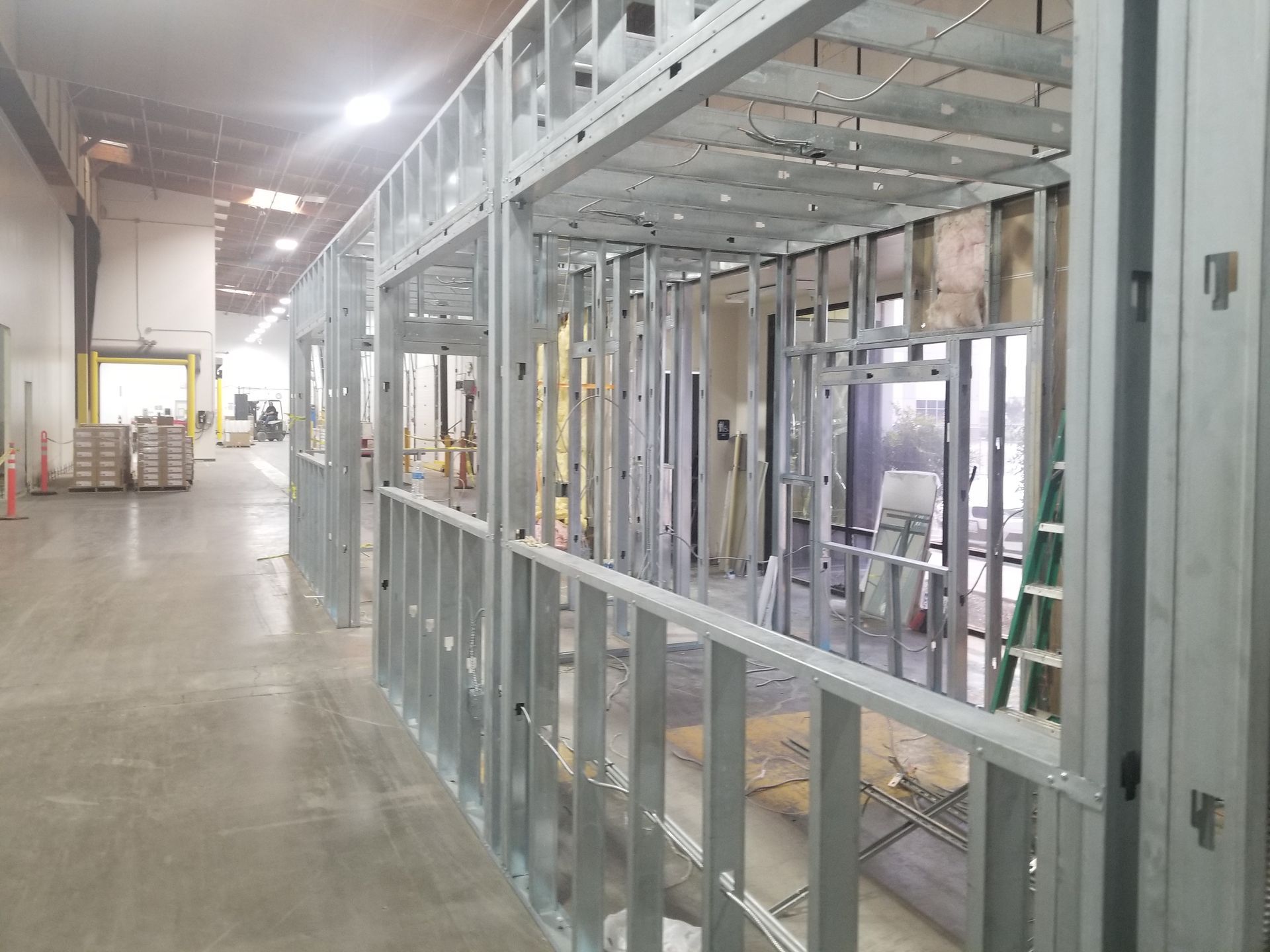 A building under construction with a lot of metal frames.