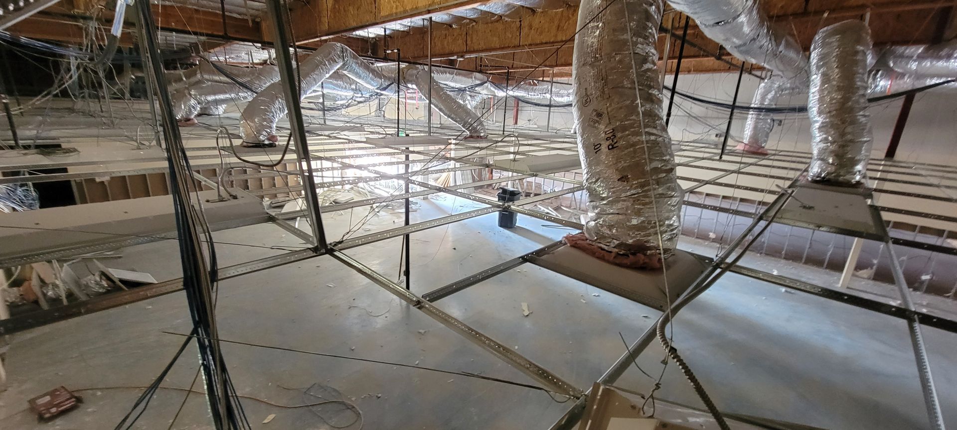 A room with a lot of wires hanging from the ceiling.