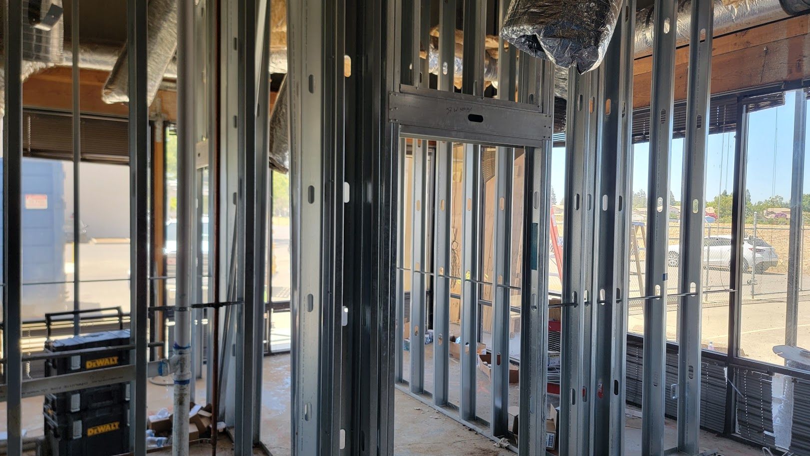 The inside of a building under construction with a lot of metal frames.