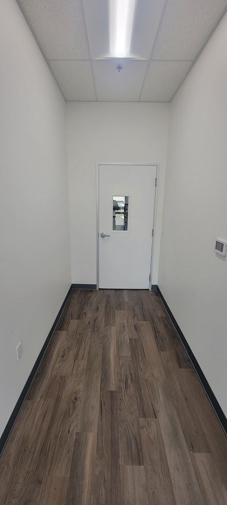 There is a door in the middle of the hallway.