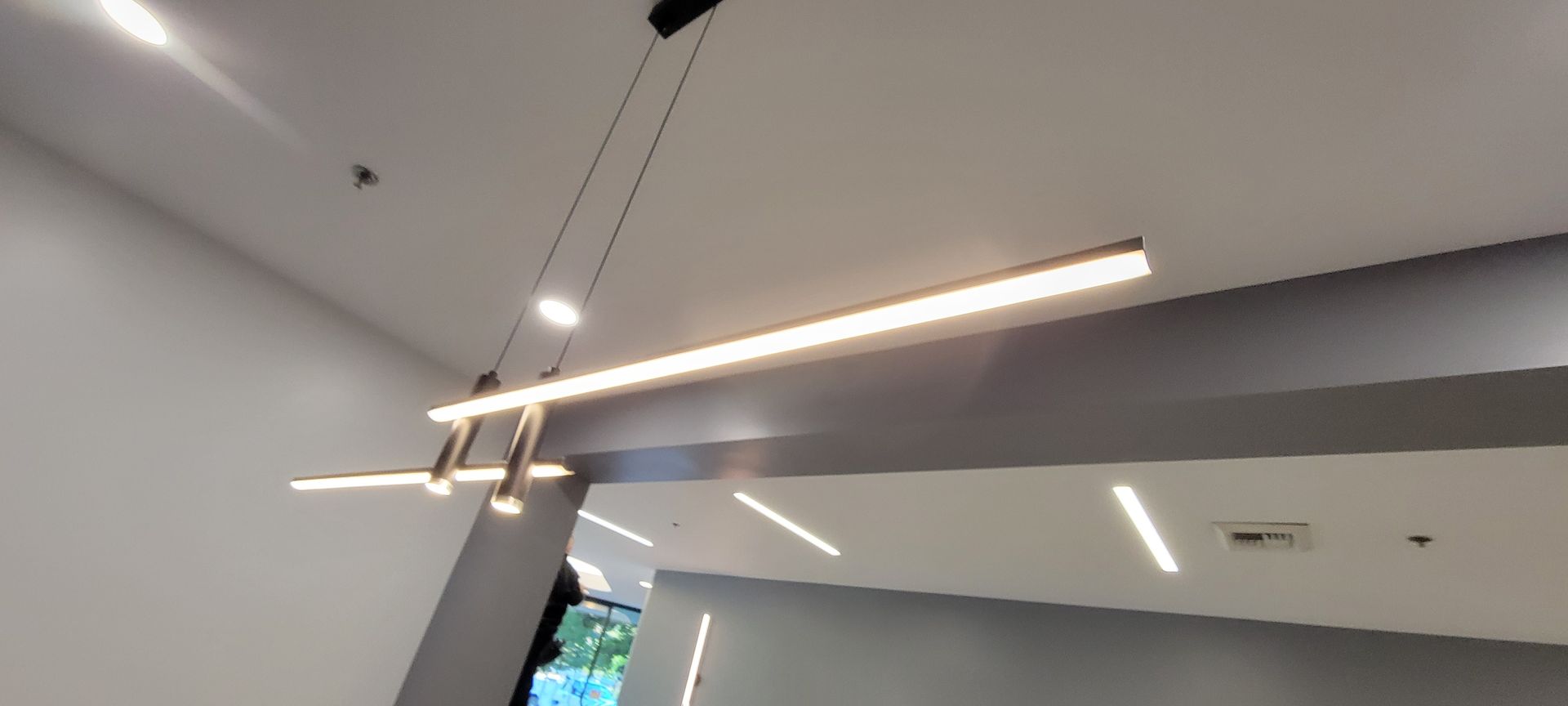 A ceiling with a lot of lights hanging from it