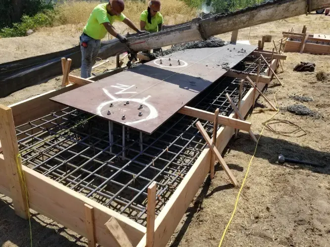 A couple of men are working on a construction site.
