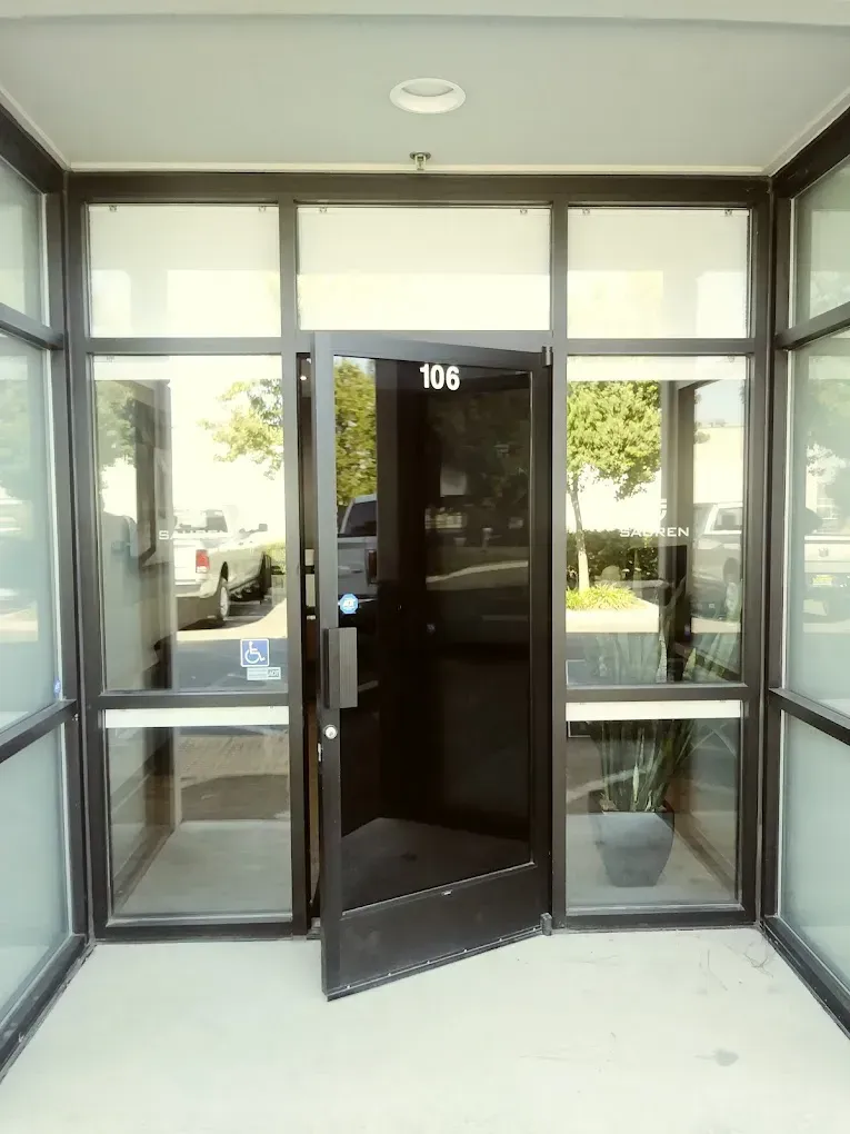 A black door with the number 1016 on it