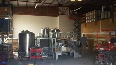 A large brewery filled with lots of machinery and equipment