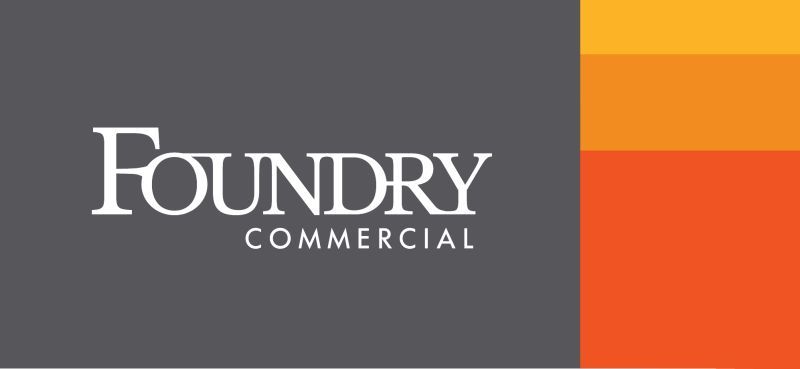 Foundry Commercial logo in white on a dark gray and orange background