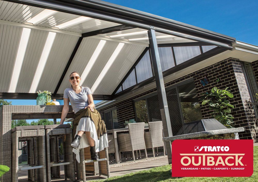 Lady Smiling in Verandah — Geelong, VIC — Absolute Patios