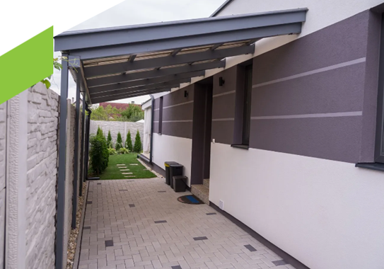 Front view of an open carport frontier outside of a house.