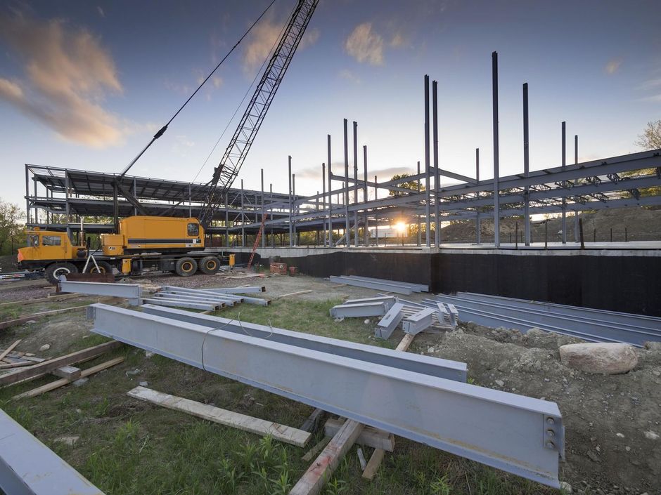 a construction site with a crane in the background