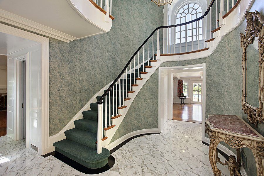 big house with wood stair railings
