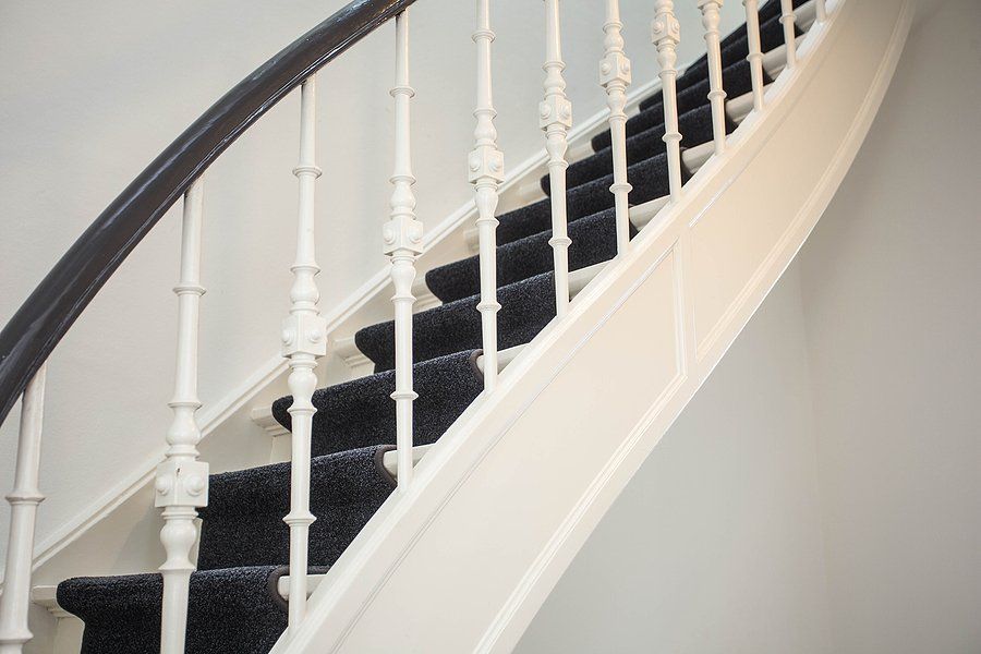 wooden stairs with carpet