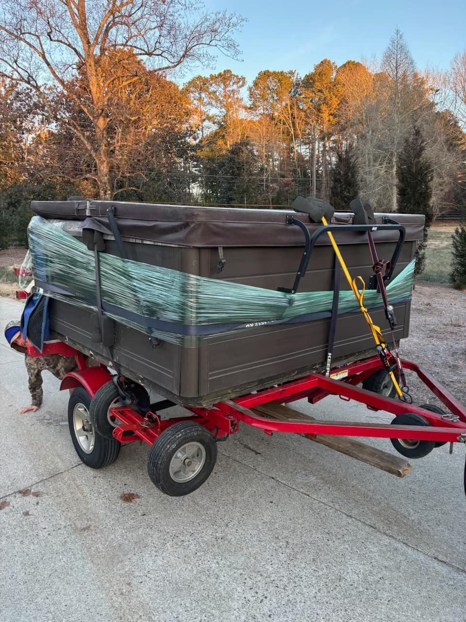 A hot tub is sitting on top of a trailer.