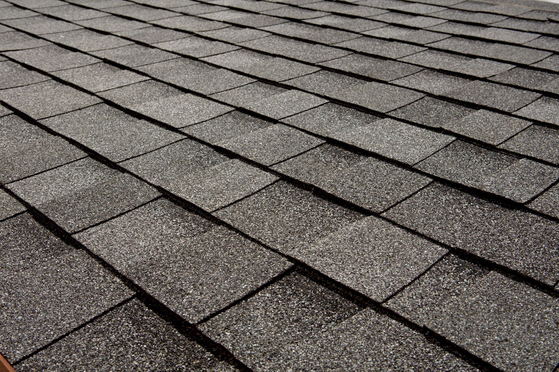 Gray asphalt shingles on a roof.