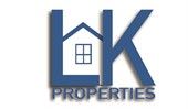Logo for LK Properties, blue lettering with house icon in the