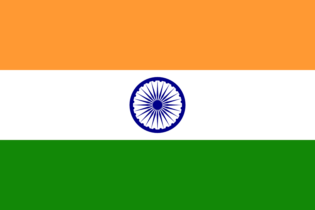 The flag of india is orange , white and green with a blue circle in the middle.