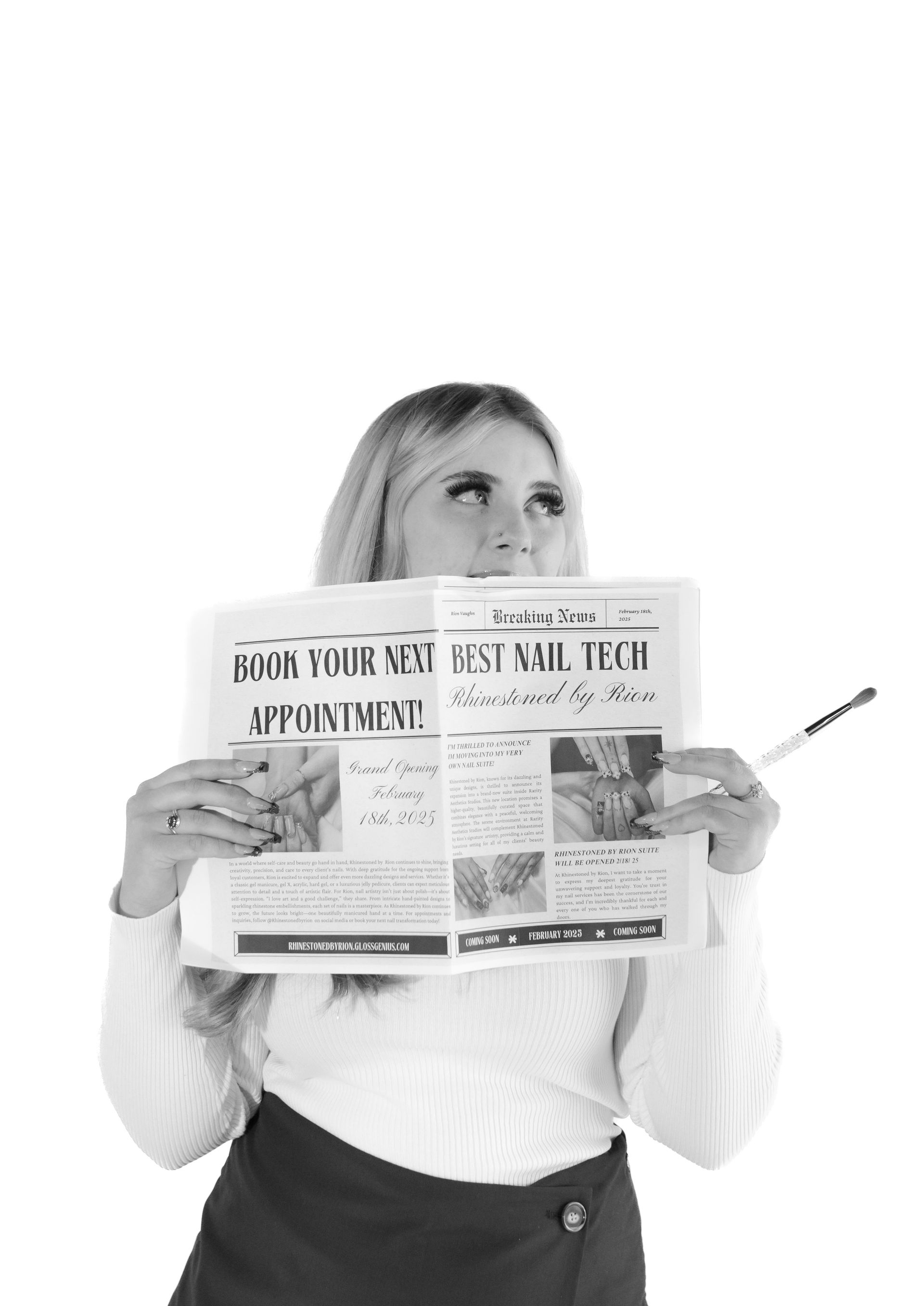 A woman is holding a newspaper with a pen in her hand.