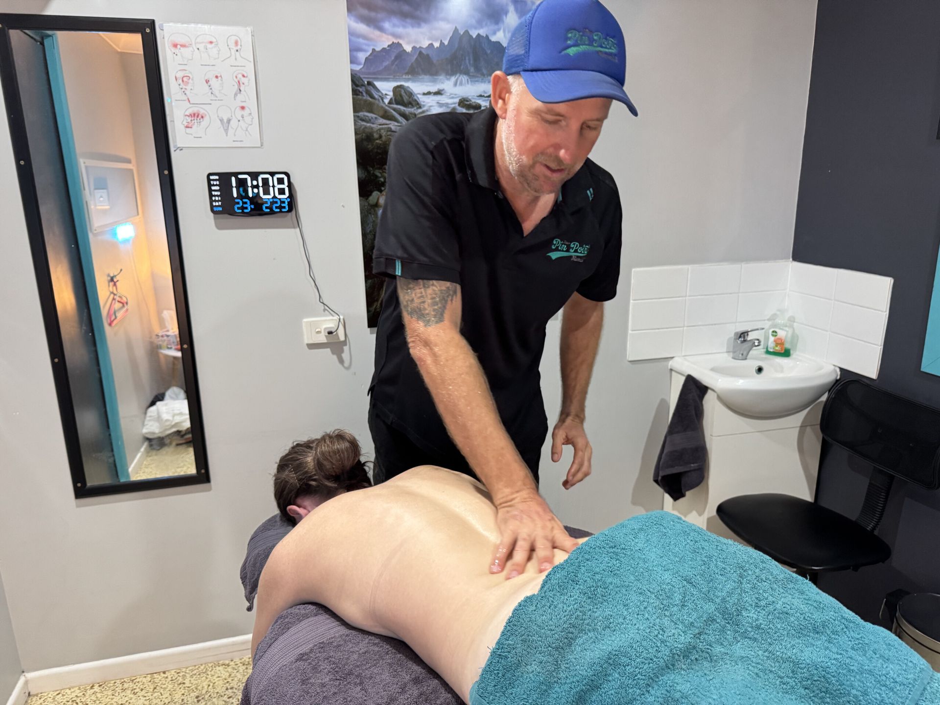A Man Is Giving A Woman A Neck Massage — Pin Point Remedial Massage In Lammermoor, QLD