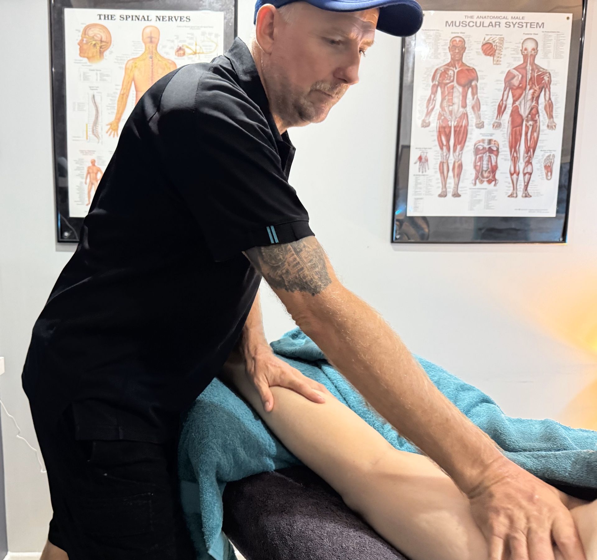 A Man Is Helping A Woman Do Exercises In A Gym — Pin Point Remedial Massage In Lammermoor, QLD