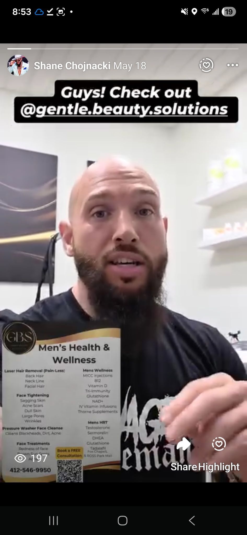 Man pointing at a poster for 