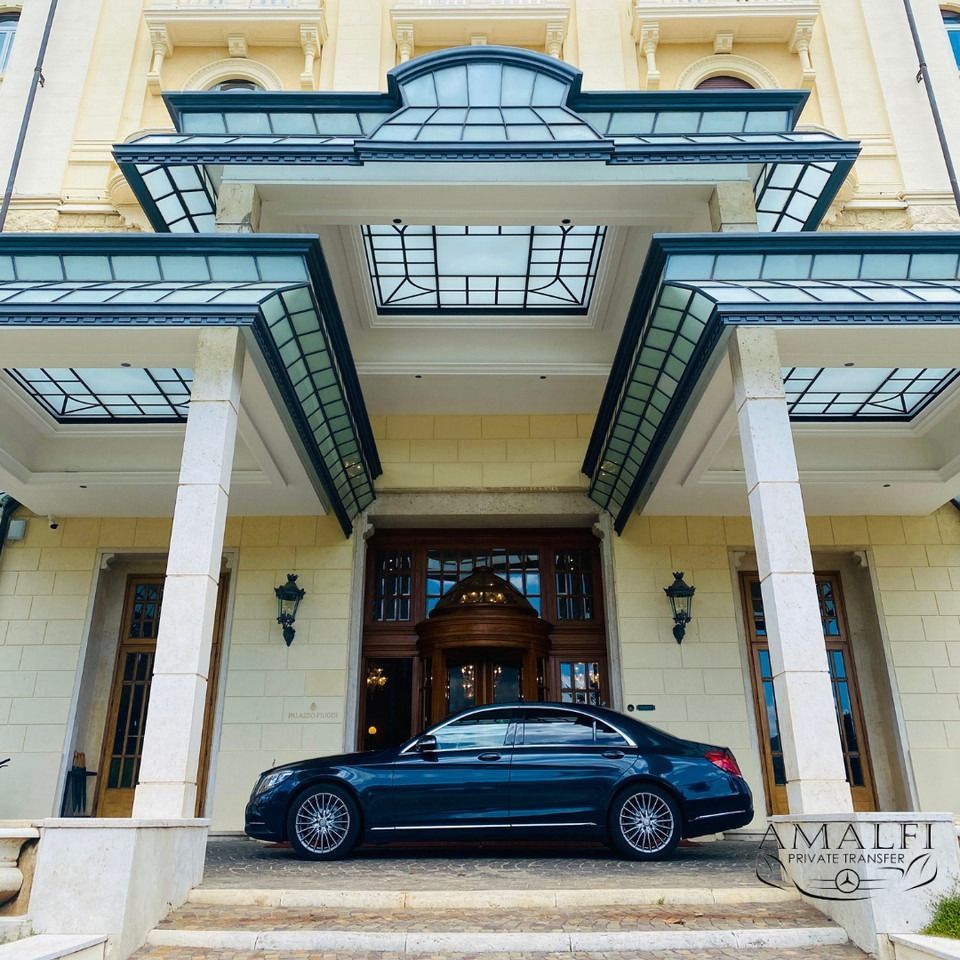 black car in front of a hotel entrance