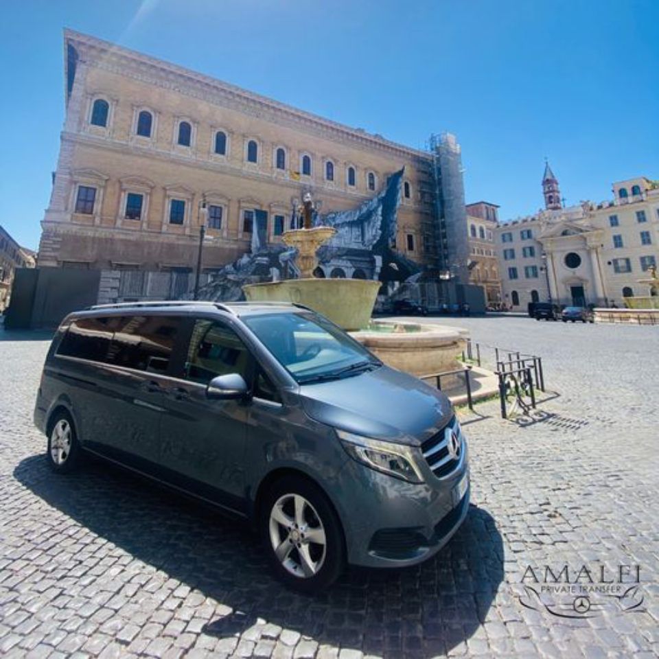 grey Mercedes minivan parked in a square