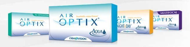 Boxes of Air Optix contact lenses in different colors.