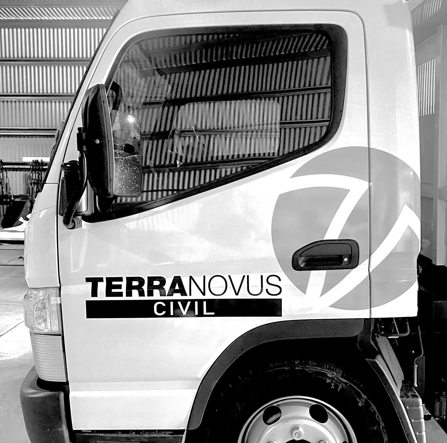 White Terra Novus Civil Truck With Logo, Parked Inside a Building — Millard Signs in Portsmith, QLD