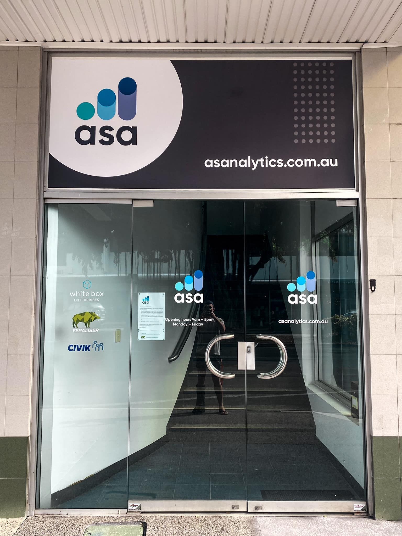 Group Poses Behind a Photo Frame at a Bar — Millard Signs in Bungalow, QLD
