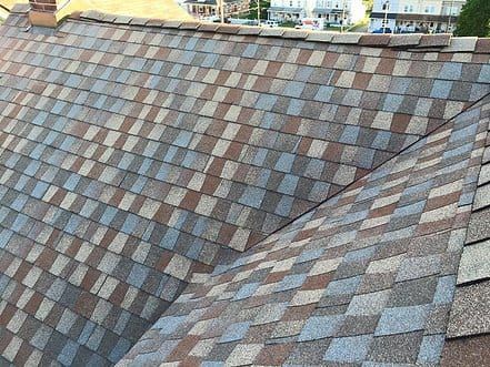 A close up of a roof with shingles on it.