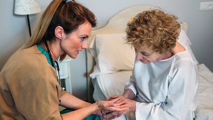 nurse speaking with patient