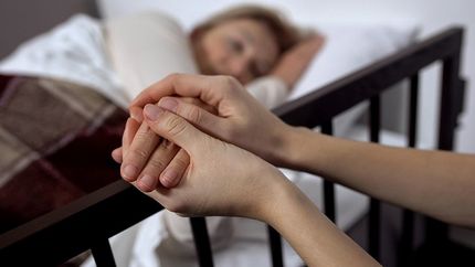 nurse holding hands of a patient