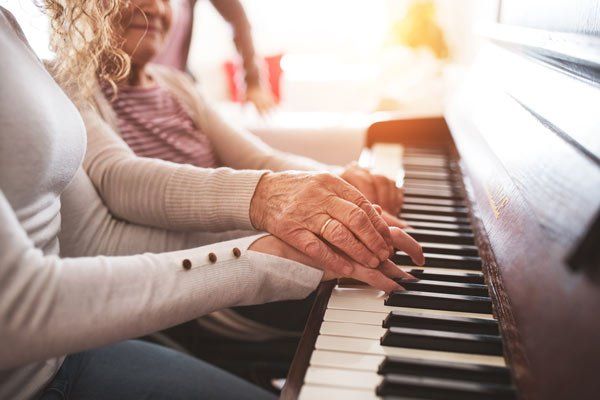 elderly hands playing piano