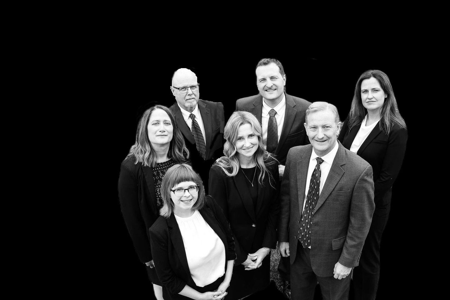 Black and white group photo of the firm's attorneys looking up