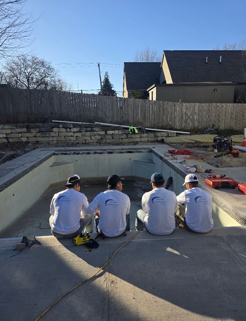 a residential pool undergoing a renovation with Elite construction pools. blue sky