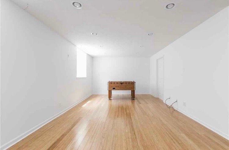 There is a table in the middle of the room.