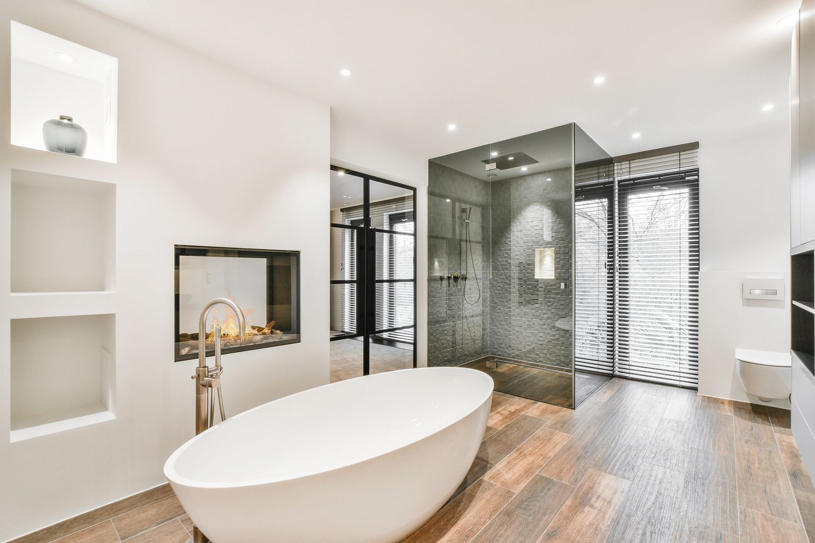 A bathroom with a bathtub and a walk in shower.