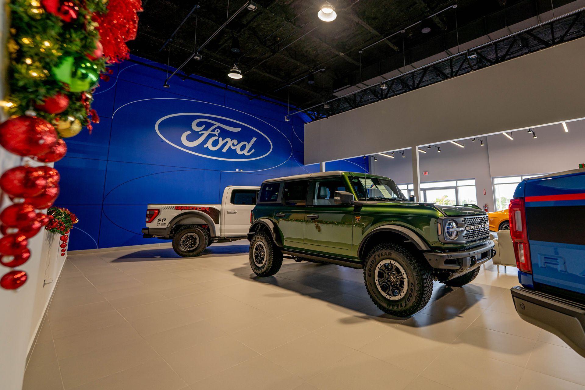 A ford truck displayed in a showroom designed and built by DEV Builders.