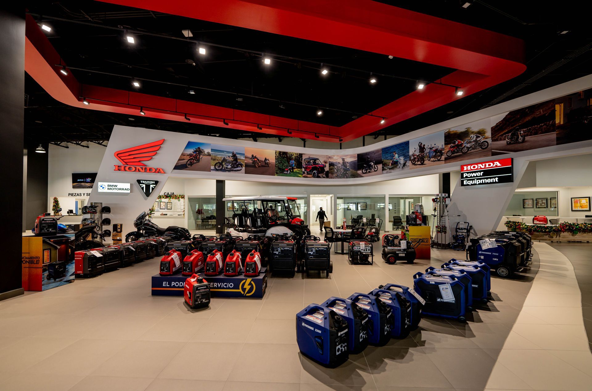 A honda dealership with a lot of motorcycles on display designed and built by DEV Builders