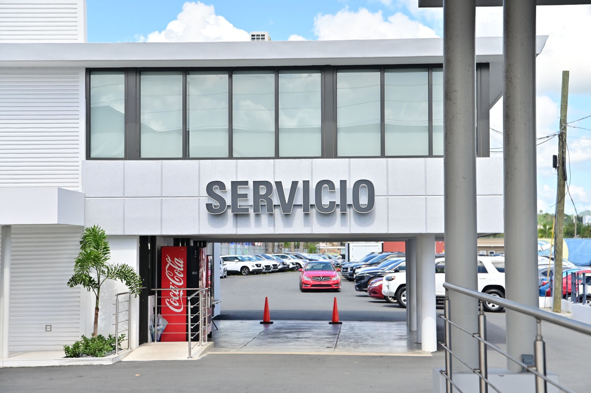 A car dealership built by DEV Builders Group. Inside you can see a luxurious car.