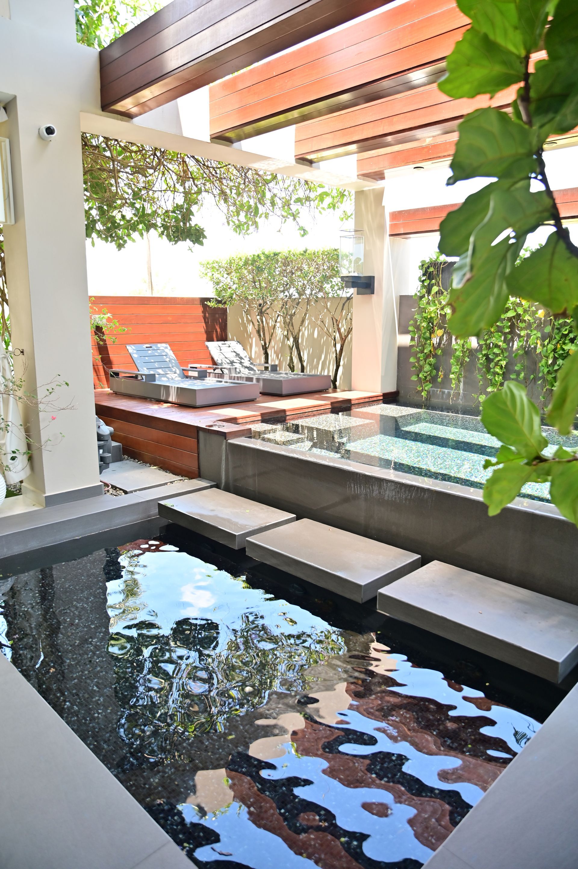 There is a large luxury pool in the middle of the garden designed and built by DEV Builders