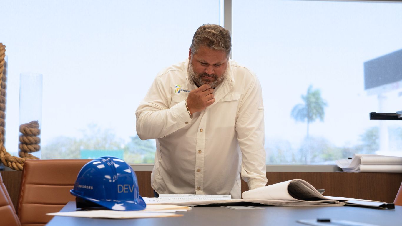 DEV Builders Group Employee viewing blueprints